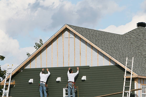 Professional Storm Damage Siding Repair technician working in Enola, PA